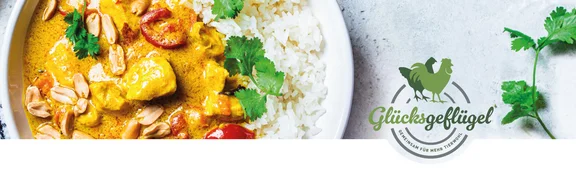 Bannerbild zur Aktion "Glücksgeflügel" von einem Tellergericht mit Hähnchen, Cashews und Reis